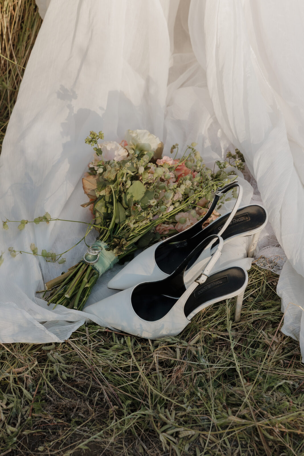 Wedding detail photos with flowers, shoes, and dress taken by Kassidy Klicks San Diego wedding photographer