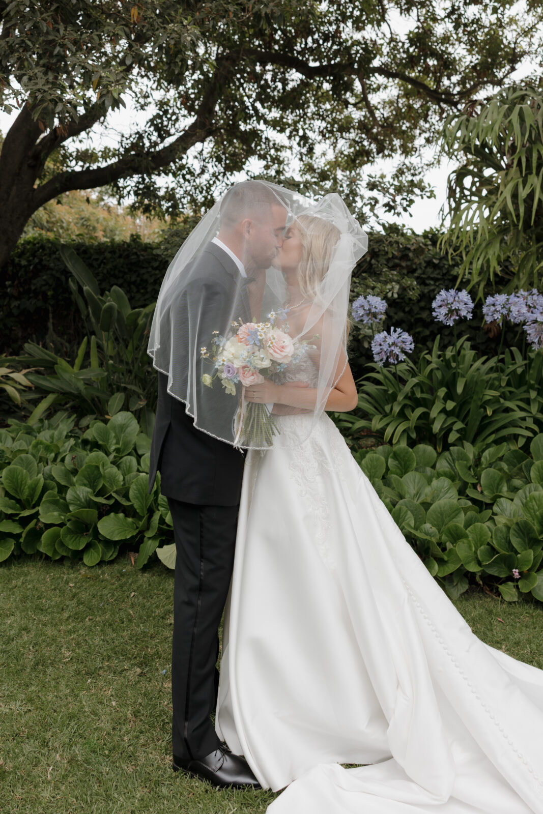 Iconic veil photos at Mcgrath Ranch and Gardens California wedding venue outdoors