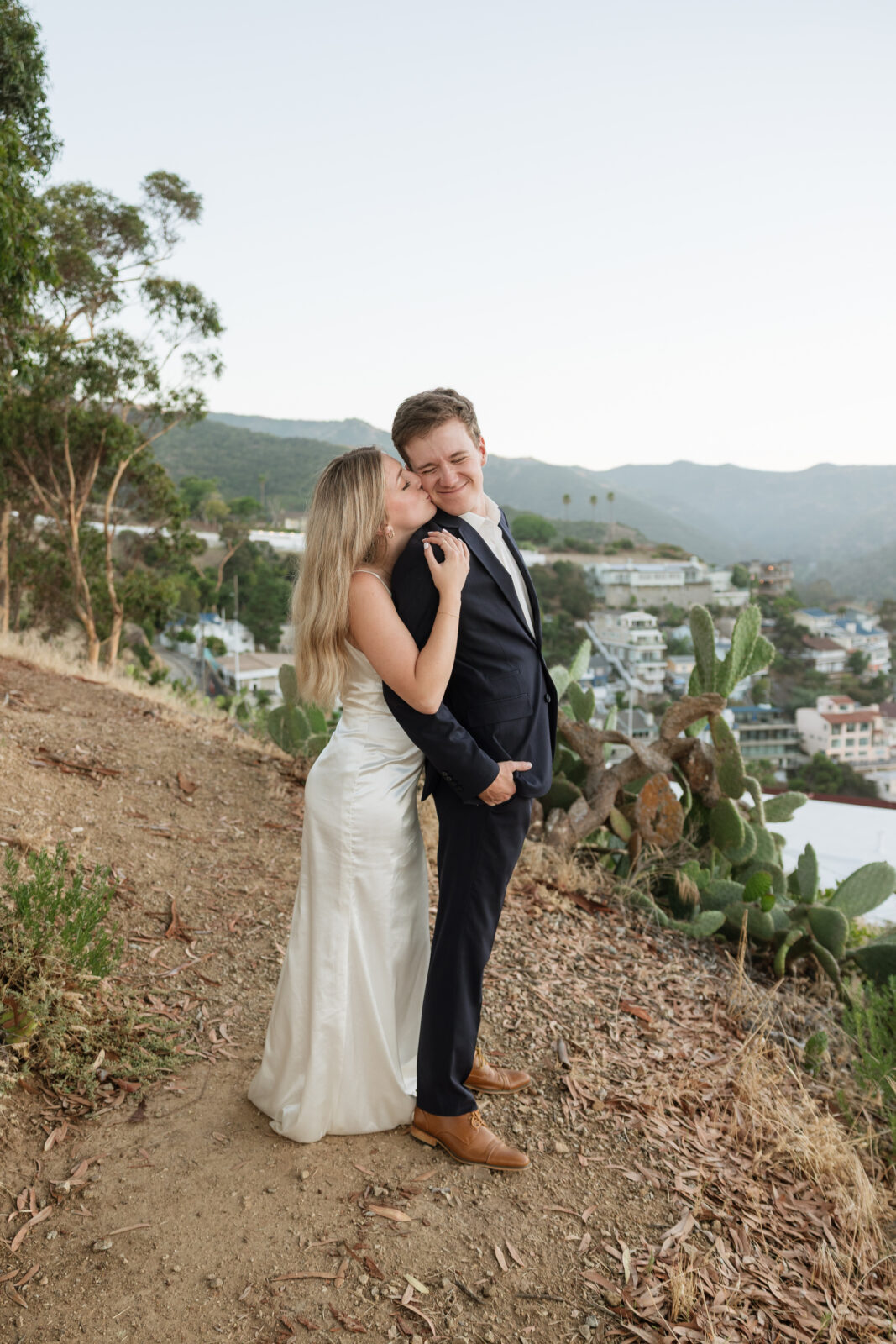 Catalina Island elopement bride and groom on cliffside by Kassidy Klicks Catalina Elopement Photographer