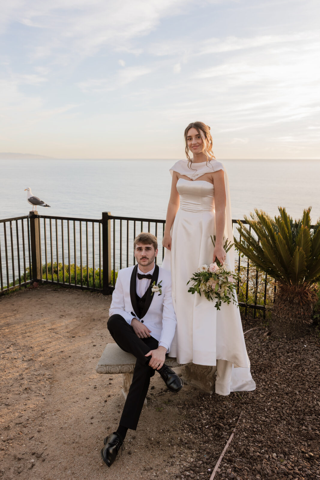 Bride and groom sharing intimate, classic wedding moments in Pismo Beach, California, captured in timeless style by Southern California wedding photographer