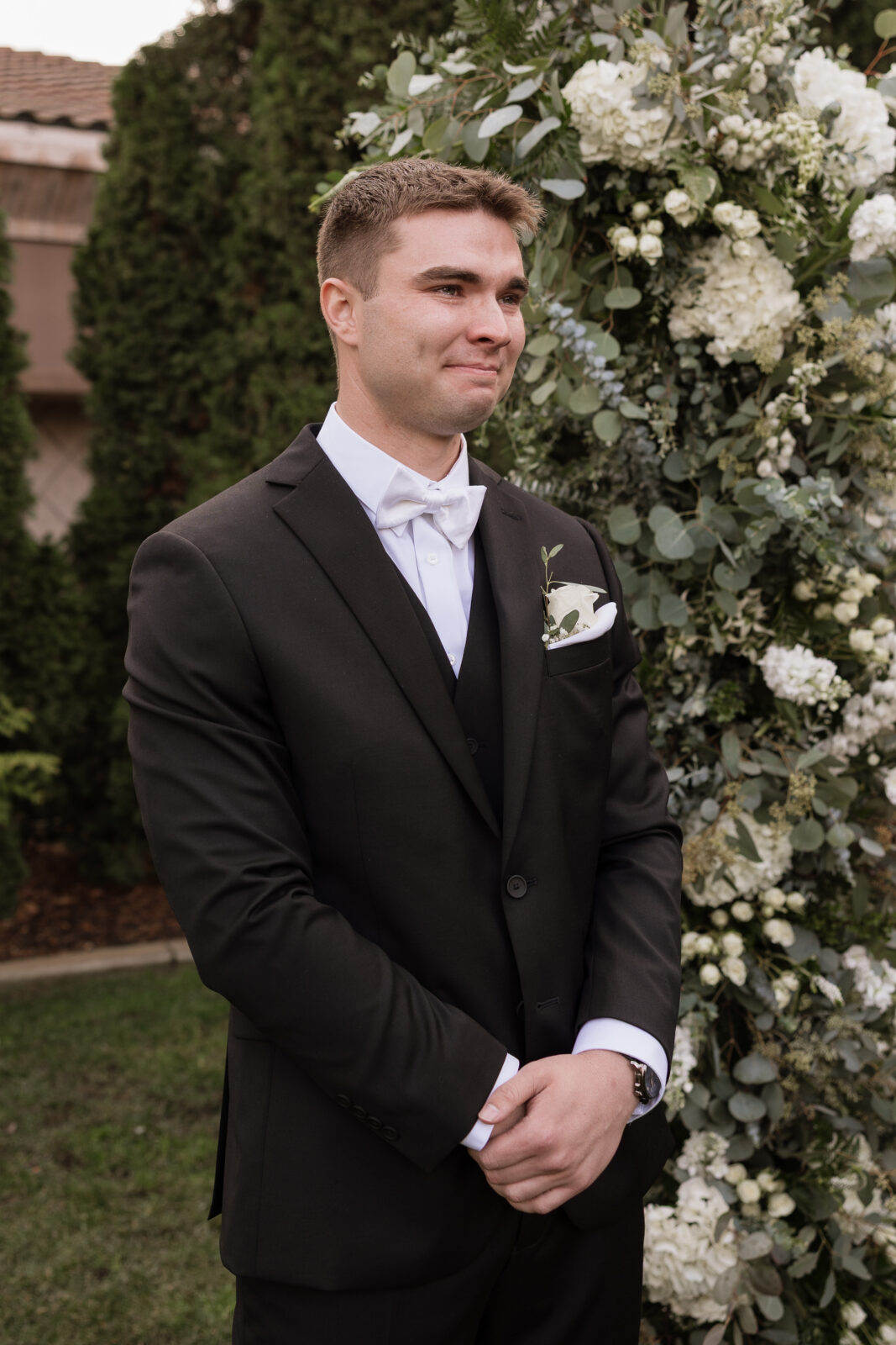 Grooms reaction to bride as she walks down the aisle at outdoor wedding in Socal by Kassidy Klicks