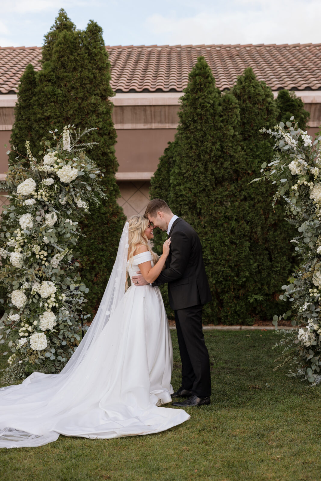 Sweet candid moment of bride and groom during ceremony taken by Temecula wedding photographer KASSIDY KLICKS