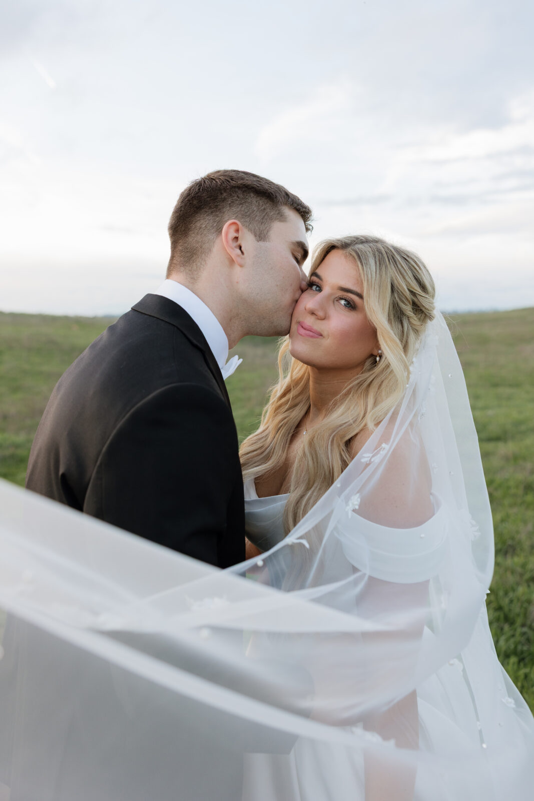 Bride and groom veil portraits at Socal Wedding venue taken by KASSIDY KLICKS